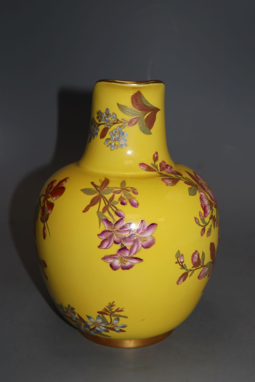 A Royal Worcester yellow ground jug, height 21cm